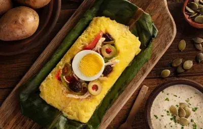 Tamal de papa con ají de pepa de sambo Tamal de papa con ají de pepa de sambo